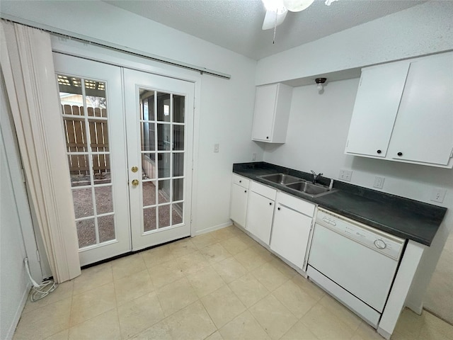 kitchen with a textured ceiling, white dishwasher, ceiling fan, sink, and white cabinetry