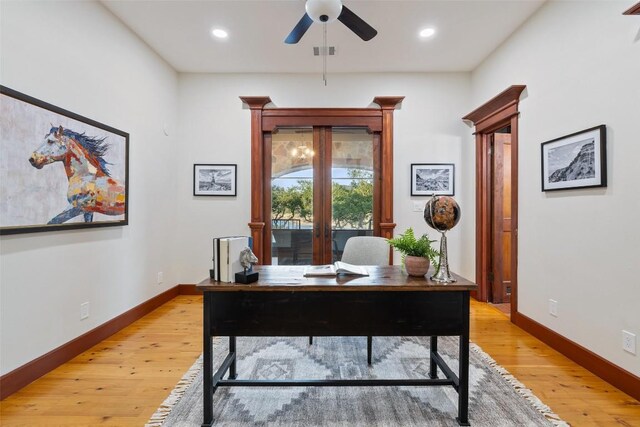 office space with light hardwood / wood-style flooring and ceiling fan