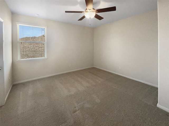 spare room featuring ceiling fan and carpet floors