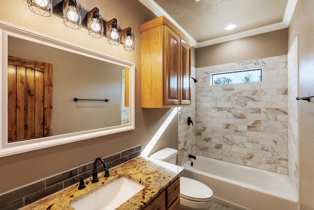 full bathroom featuring tiled shower / bath combo, crown molding, a textured ceiling, toilet, and vanity