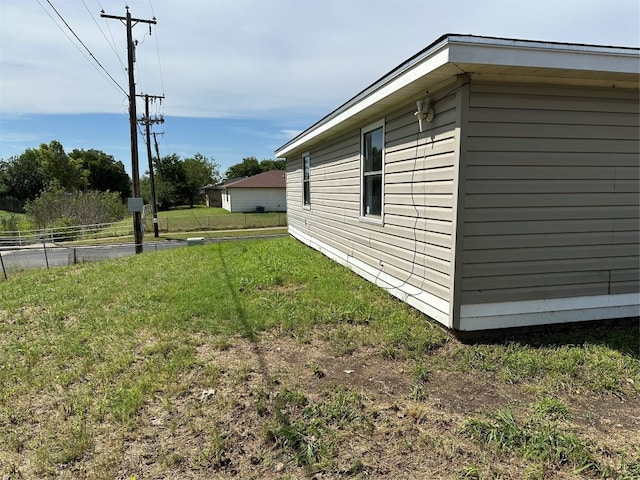 view of property exterior featuring a yard