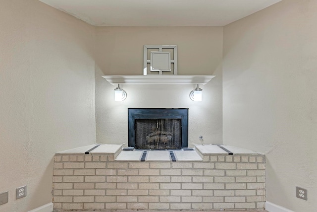 bathroom with a brick fireplace