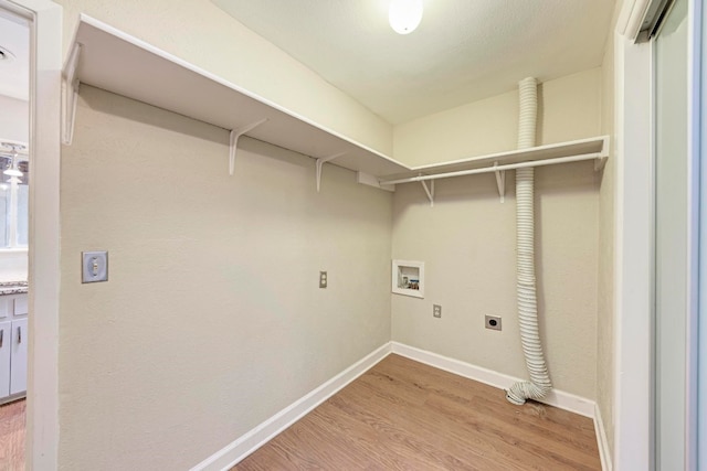 laundry room with hookup for a washing machine, hardwood / wood-style floors, and hookup for an electric dryer