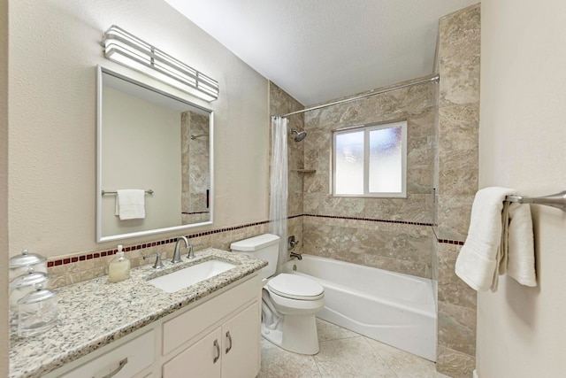 full bathroom with vanity, tile patterned flooring, toilet, a textured ceiling, and shower / tub combo with curtain