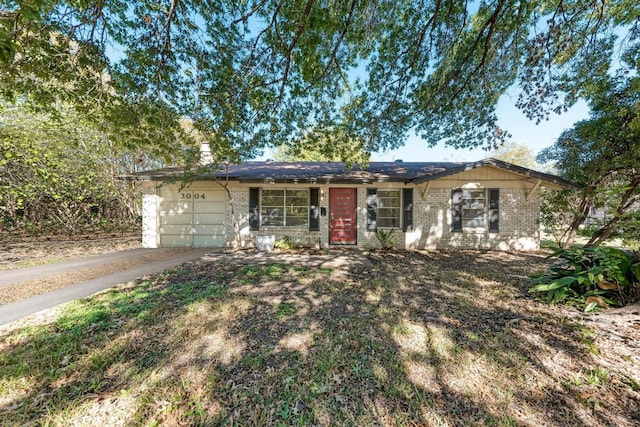 single story home featuring a garage