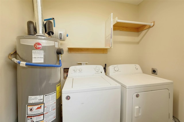 laundry room featuring gas water heater and washing machine and clothes dryer