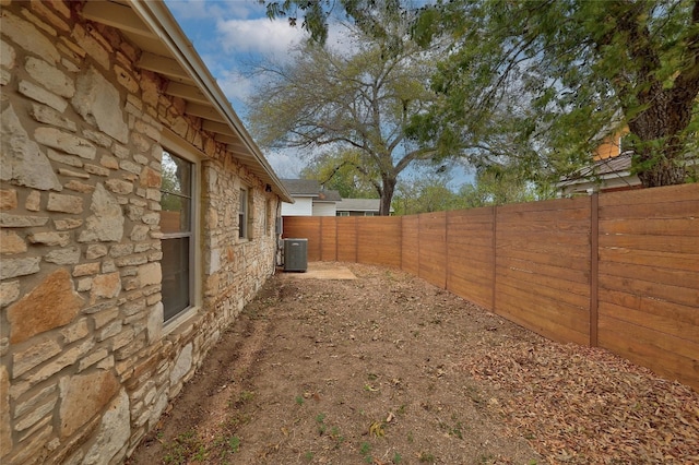 view of yard with central AC unit