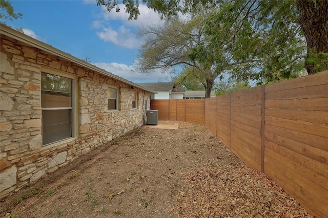 view of yard with central AC unit