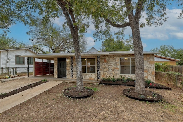 ranch-style home with a carport