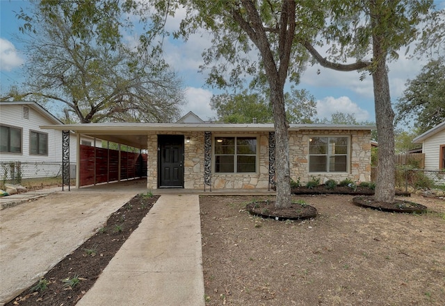 ranch-style house with a carport