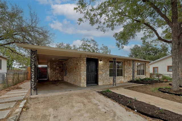 view of front of property with a carport