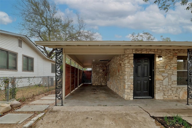 view of parking / parking lot featuring a carport