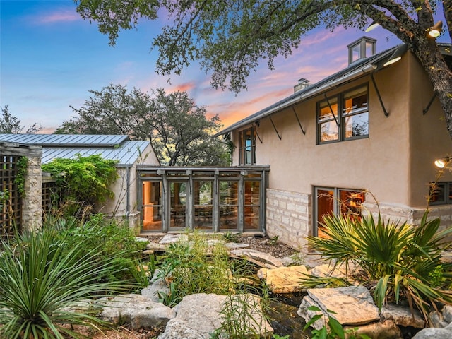 exterior space featuring a sunroom