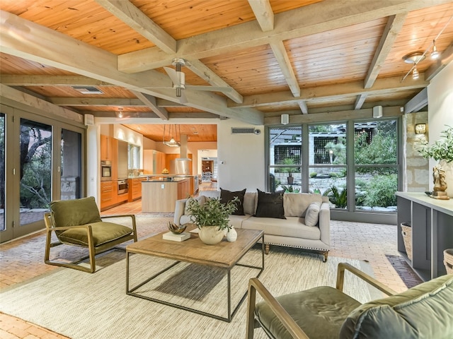 living room featuring beam ceiling, ceiling fan, and wooden ceiling