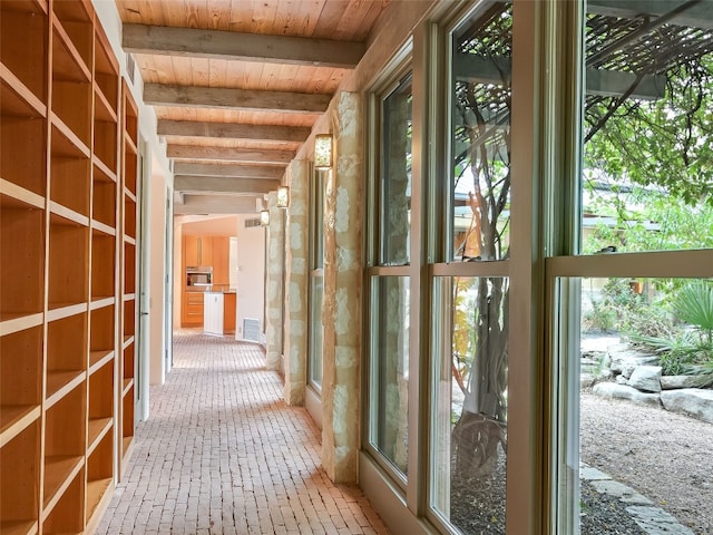 hall with beam ceiling and wood ceiling