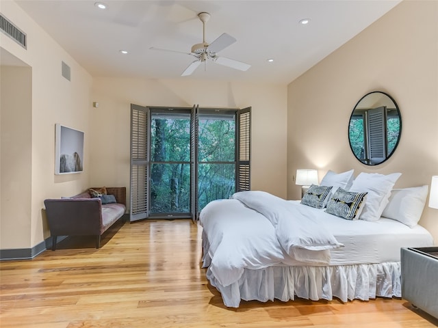 bedroom with ceiling fan and light wood-type flooring