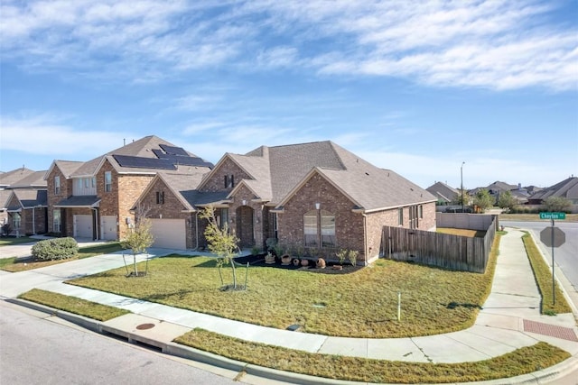 19316 Chayton Cir, Pflugerville, TX 78660 - view of front facade featuring brick siding, concrete driveway, and a residential view