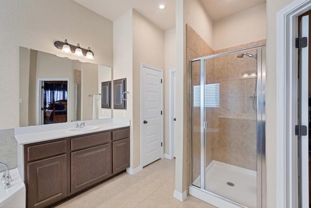 19316 Chayton Cir, Pflugerville, TX 78660 - bathroom featuring a shower stall, vanity, tile patterned floors, and a garden tub