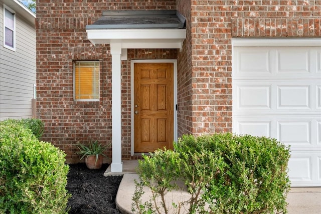 entrance to property featuring a garage