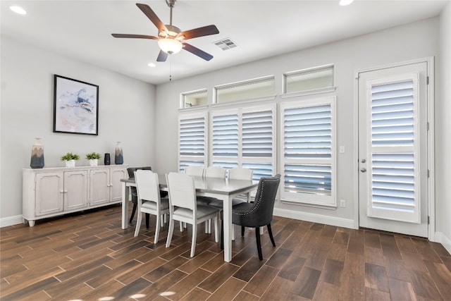 dining area with plenty of natural light, ceiling fan, and dark hardwood / wood-style flooring