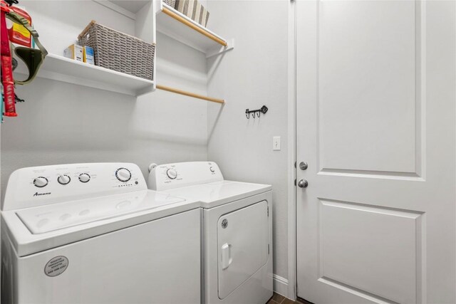 clothes washing area with laundry area and separate washer and dryer