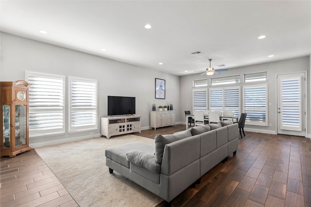 living room featuring hardwood / wood-style flooring and ceiling fan