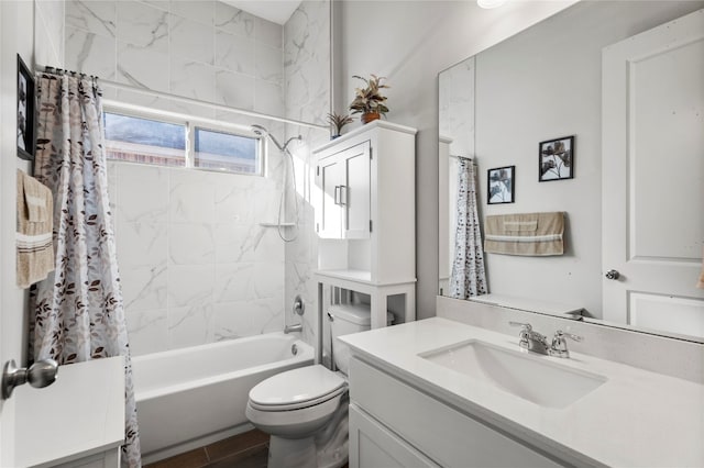 full bathroom with vanity, shower / bath combination with curtain, and toilet