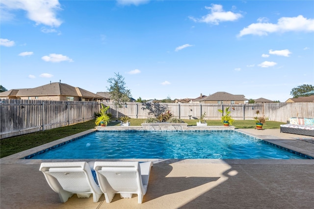 view of pool with a patio area and pool water feature