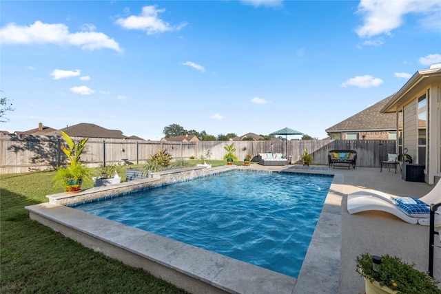 view of pool with a patio and pool water feature