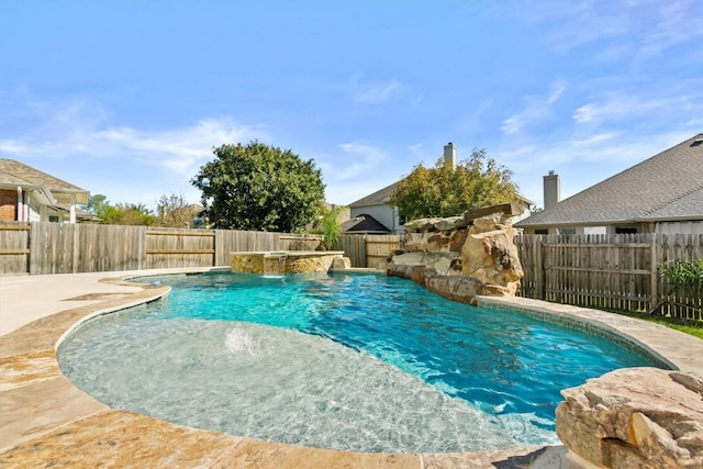 view of swimming pool with pool water feature