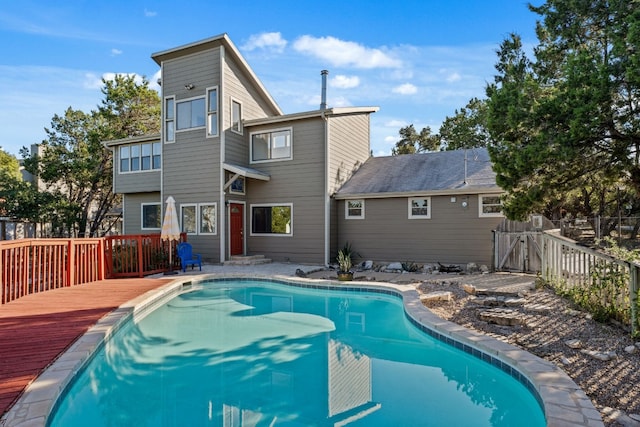 view of swimming pool featuring a deck