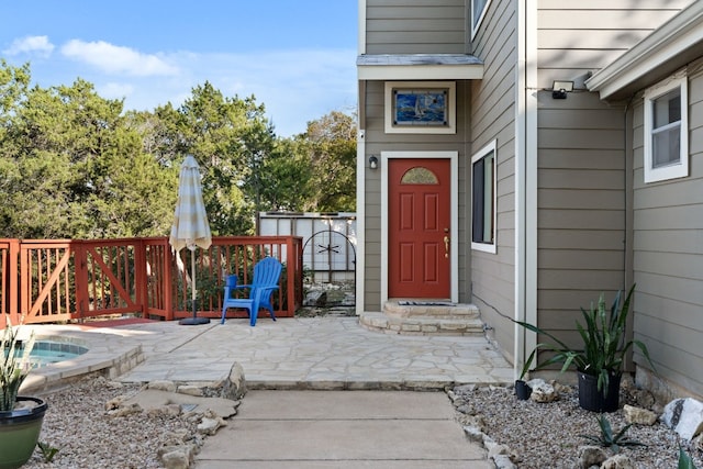 property entrance featuring a patio