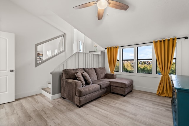 living room with light wood-type flooring and ceiling fan