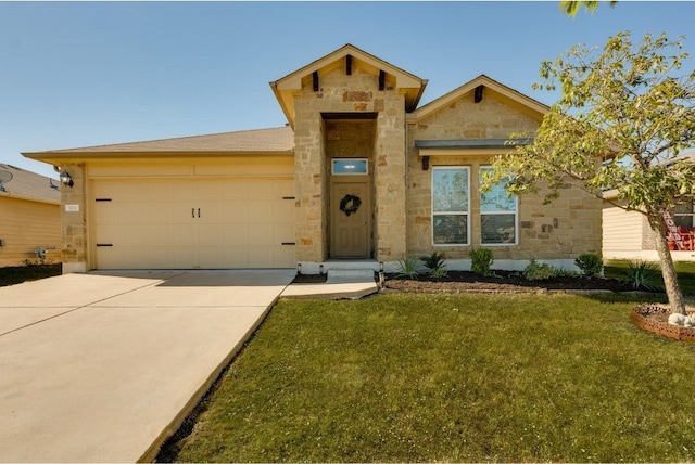 view of front of home with a garage and a front yard