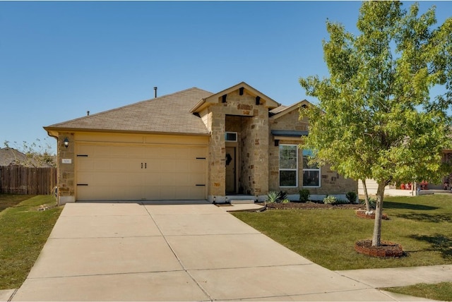 view of front of house featuring a garage and a front yard