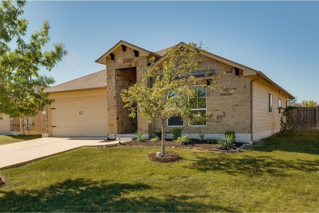 view of front of house featuring a garage and a front lawn