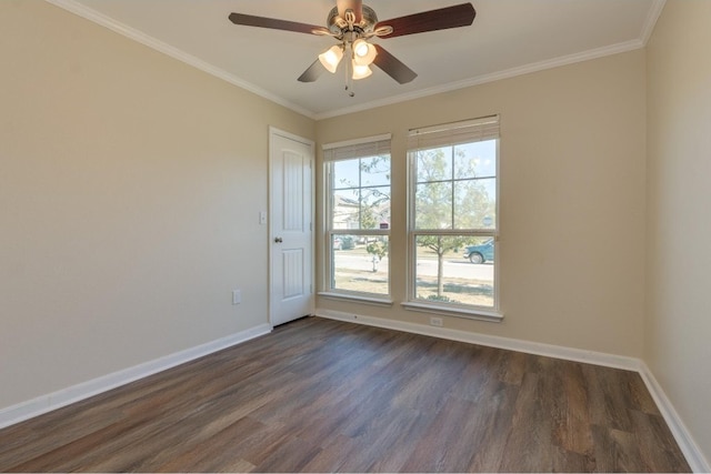 empty room with ceiling fan, dark hardwood / wood-style flooring, and crown molding