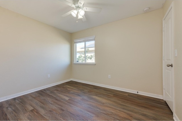 empty room with ceiling fan and dark wood-type flooring