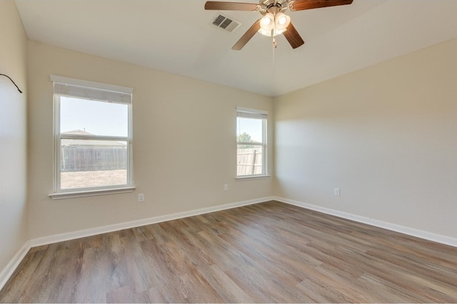 unfurnished room featuring ceiling fan and light wood-type flooring