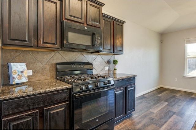 kitchen with dark stone counters, backsplash, dark hardwood / wood-style flooring, and black appliances