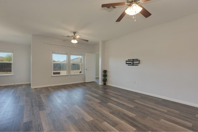 unfurnished room with ceiling fan and dark hardwood / wood-style flooring