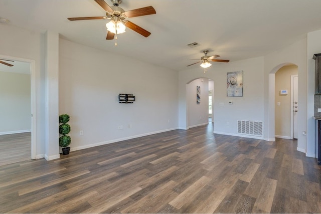 unfurnished living room with dark hardwood / wood-style floors