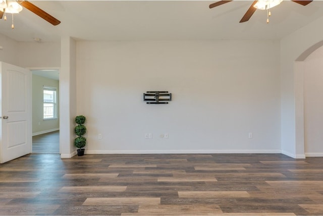 spare room with ceiling fan and dark hardwood / wood-style flooring