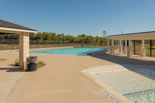 view of swimming pool with a patio area