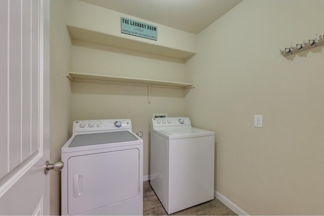 washroom featuring light wood-type flooring and separate washer and dryer