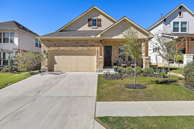 view of front of house featuring a front yard and a garage