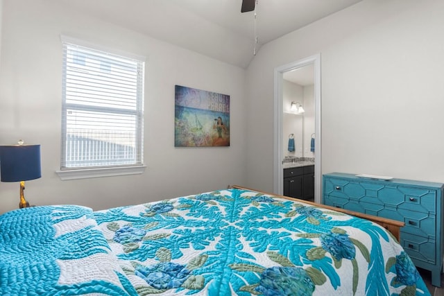 bedroom featuring connected bathroom, ceiling fan, and lofted ceiling