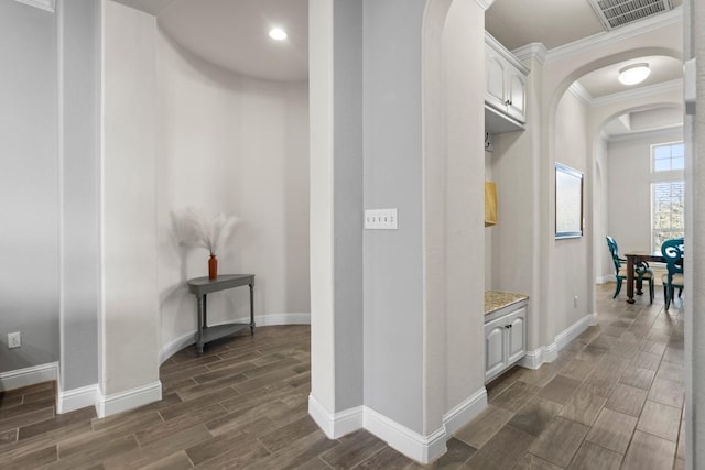 interior space featuring dark hardwood / wood-style flooring and crown molding