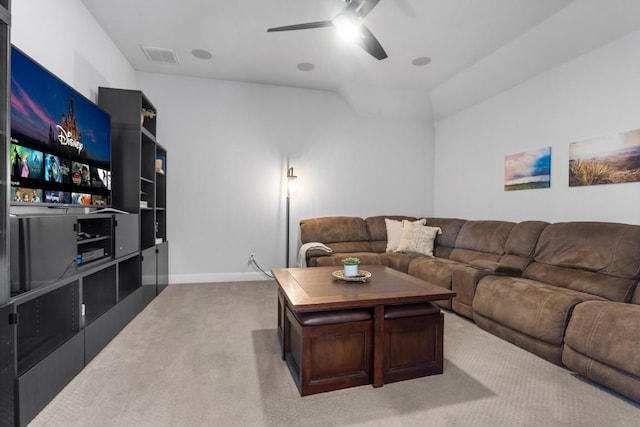 living room featuring light carpet, ceiling fan, and vaulted ceiling