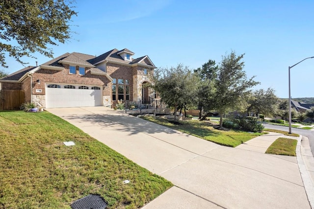 view of front facade with a front yard and a garage